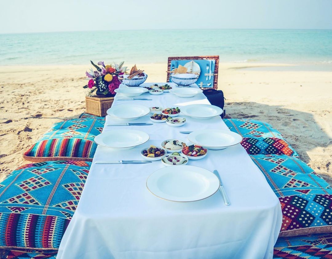 #OneDaySoon we hope to be dining on Jarada Island at @ritzcarltonbahrain 🏝⁣
⁣
For the ultimate castaway experience, sail across crystal-clear waters on the hotel’s Pearl 1 boat to the deserted strip of sugar white sand – only accessible for two hours a day before the tide washes it away – and dine on a lavish picnic of authentic Bahraini dishes, drinks and decadent deserts 🌊🍹⁣
⁣
#RCMemories #RitzCarltonBahrain #JaradaIsland #DreamNowGoLater#ArmChairTravel  #FoxCommsTravel ⁣