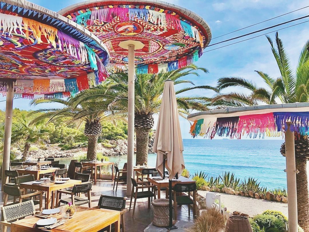 #OneDaySoon we can’t wait to be back at @ibizaaiyanna , Ibiza’s most picturesque beachside eatery 🌊🐚⁣
⁣
Both laid-back and luxe Aiyanna is the perfect destination for an Ibizan daycation, positioned on the stunning Cala Nova bay in the North of the island, guests can expect to find sumptuous seafood and thirst-quenching cocktails on the menu 🥗🍤🍹⁣
⁣
Aiyanna will be opening again on June 26th 🗓⁣
⁣
#DreamNowGoLater #ArmchairTravel  #FoxCommsTravel #FoxCommsLifestyle